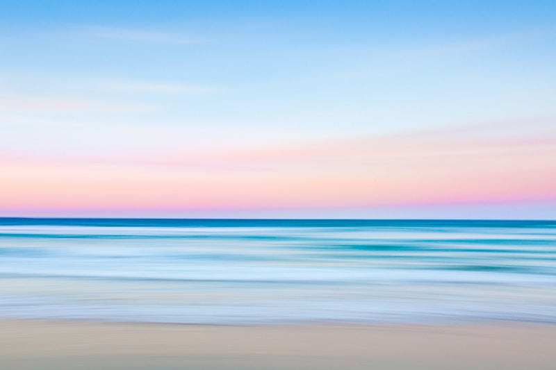 blurred lines of ocean and sunset sky abstract photograph pinks blues by julie sisco photography stradbroke