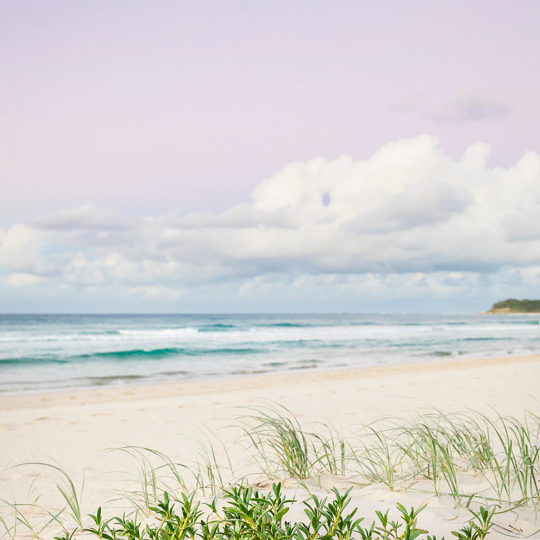 crystal clear blue water on sunny day with breaking wave wall art photography north stradbroke island