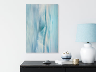 blue toned abstract wall art photographic piece by Julie Sisco North Stradbroke Island elemental on a sideboard buffet with a blue lampshade
