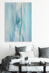 blue toned abstract wall art photographic piece by Julie Sisco North Stradbroke Island elemental with a white couch and dark grey cushions upmarket