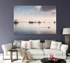 a living room with dark purple wall features an art photograph canvas of a peaceful morning with a pelican swimming in front of boats