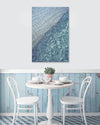 modern wall art print of blue water ocean ripples on the wall in a cafe
