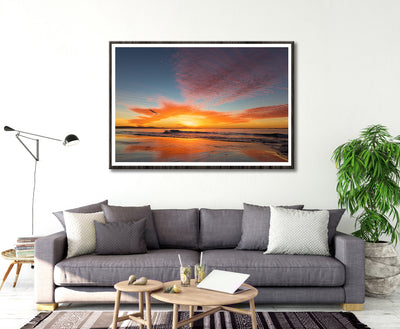 living room with framed wall art print of amazing sunset with reds and orange colours at North Stradbroke Island