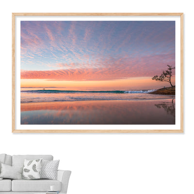 A beautiful sunset wall art print of Adder Rock with a kayaker photographed at Stradbroke Island by Julie Sisco