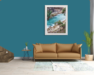 a living room featuring a wall art print of a pandanus palm and the ocean at North Gorge North Stradbroke Island